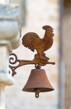 EU, France, Midi-Pyr&eacute;n&eacute;es, Carennac.  Charming rooster  doorbell outside of residence in picturesque village.