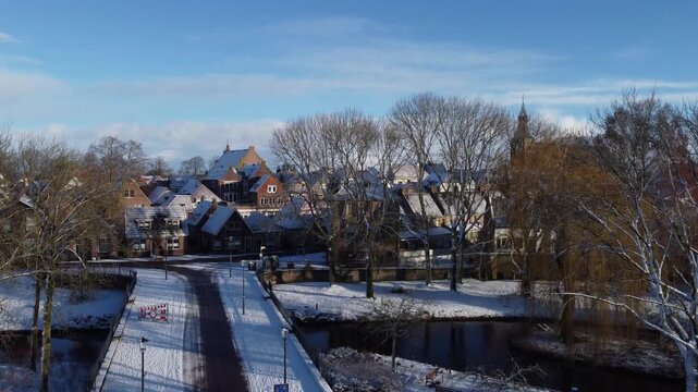 January 4th 2026 - Drone Ascending over beautiful snowy Dutch town Hattem. Winter medival center.