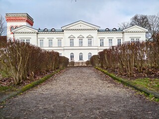 Classic mansion with symmetrical design. Grand neoclassical house with balanced architectural elements © Vladimir
