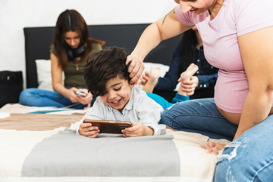 Family relaxing in bed