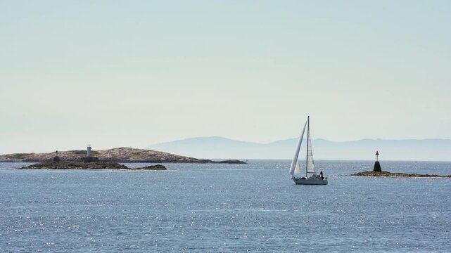 Sailing in Sunshine Haro Strait Oak Bay 4K UHD.Sailing in a stiff breeze off Cattle Point near Victoria. British Columbia, Canada. 4K, UHD.
