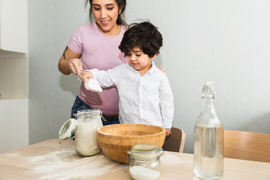 Mom and son baking at home