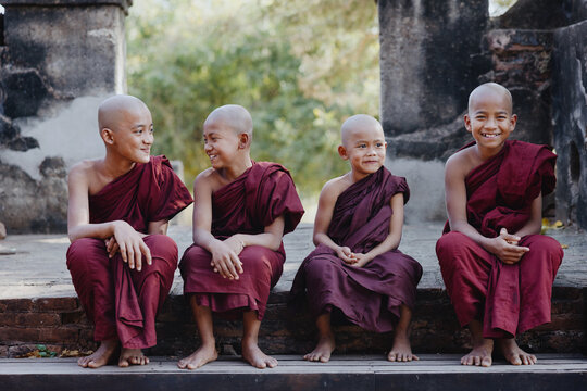 Young monks chatting on temple steps
