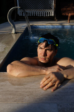 young man in a heated swimming pool