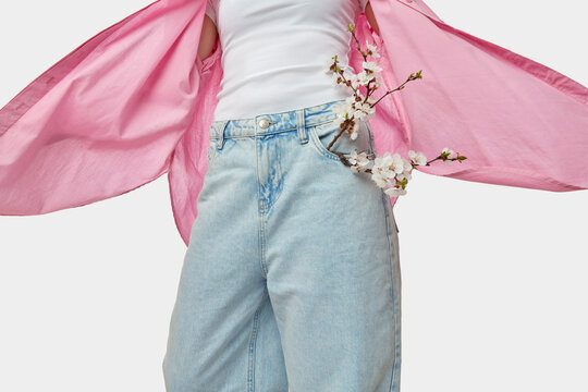 Faceless person showing stylised option of wearing baggy jeans