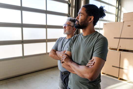 Confident diverse technicians at industry