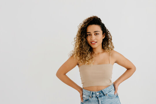 Stylish model with hands on waist in studio