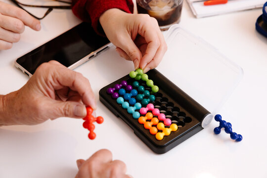 Learning through play: adults engaged in a color sorting game