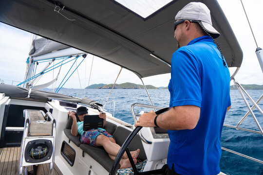 Couple on Luxury Cruising Sailboat on Caribbean Island Vacation