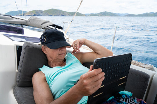 Woman Reading on Caribbean Sailing Vacation