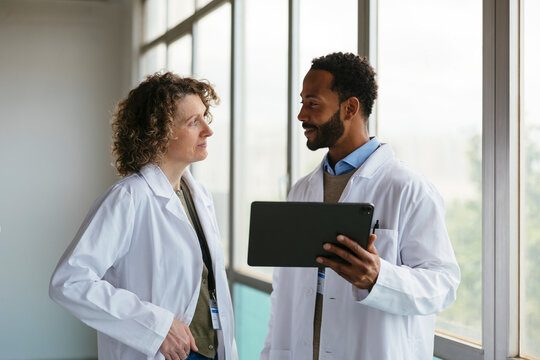 Confident doctors talking together at hospital