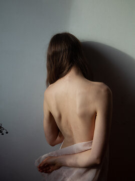 A naked girl in the sunlight 