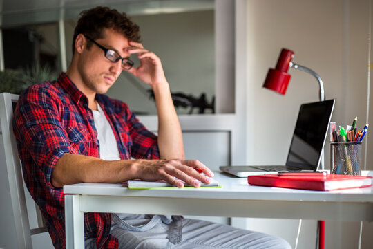 Young man concentrating at desk