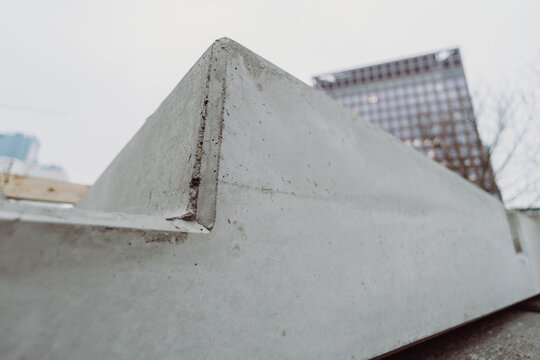 Close-up of a prefabricated concrete slab corner highlighting surface texture and precision. Architectural concrete element used in modern infrastructure construction.