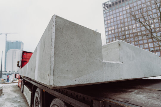 Close-up of a prefabricated concrete slab corner highlighting surface texture and precision. Architectural concrete element used in modern infrastructure construction.