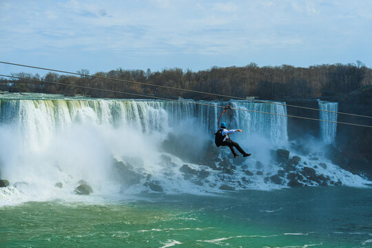 Man on a zip-line above Niagara falls 