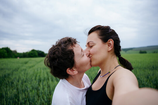 Couple of women in a field portrait selfie