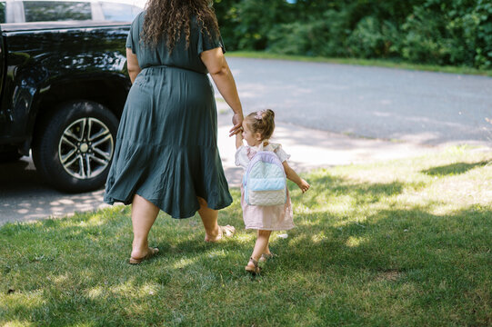 family going to car to leave together