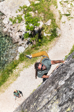 Dymanic movement of climber on granite wall