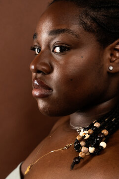 Close-Up of African American Against Brown Background