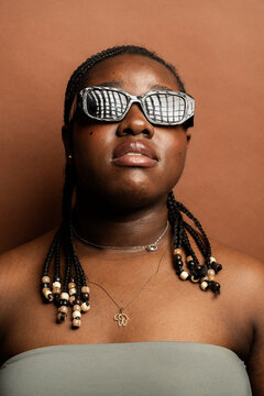 Stylish African American with Braids and Sunglasses