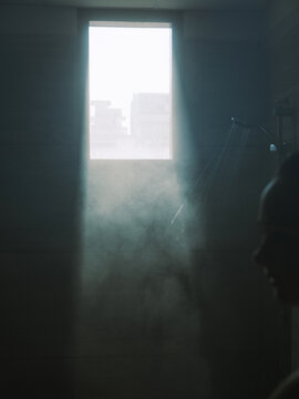 Woman taking steaming shower after the hard day 