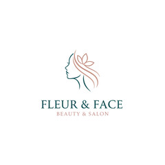 Fototapeta premium A beauty salon logo features a minimalist illustration of a woman's profile with flowing hair and floral element
