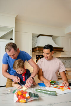 Dad Teaches Son To Cut Vegetables