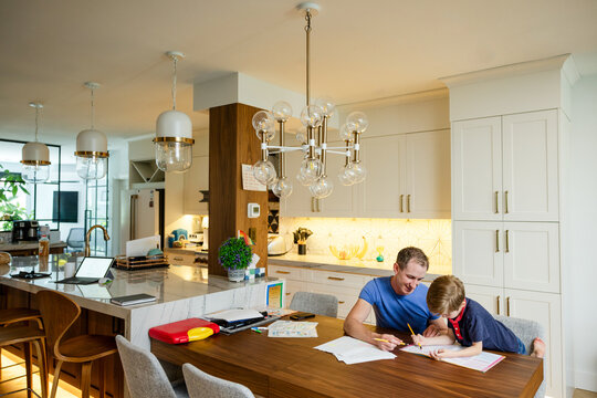 Dad Helps Son With Homework