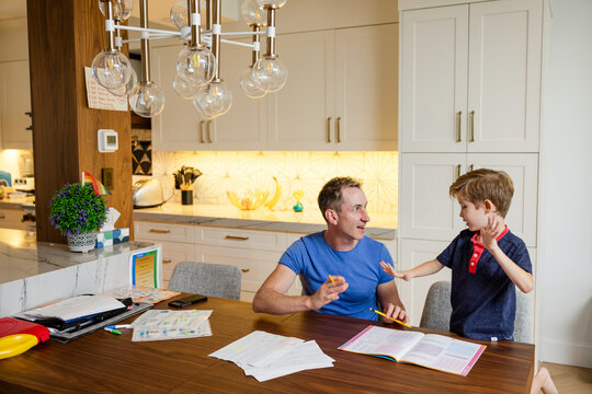 Dad Helps Son With Homework