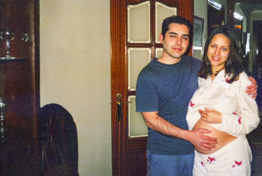 Analog image of a young married couple in their first pregnancy