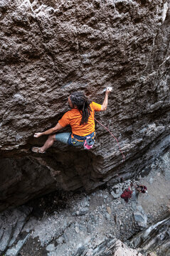 Rock climber in orange color tones
