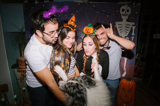 Friends with dog at Halloween party