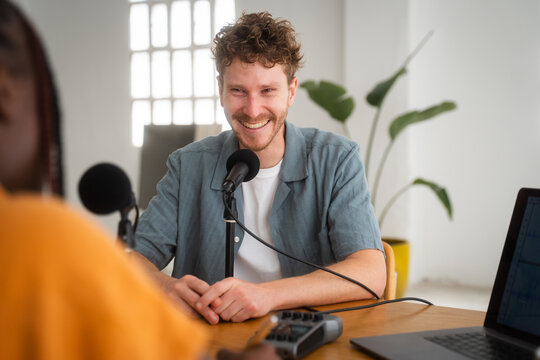 Laughing Colleagues During Podcast Broadcasting