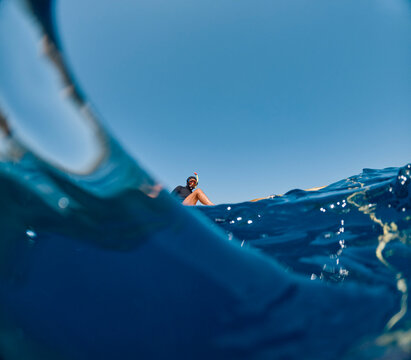 Snorkel diver gets in the water