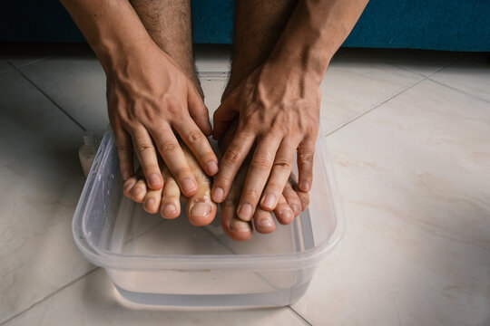Man Exfoliating his Feet