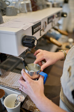 Preparing Milk Foam for Coffee at a Caf&eacute;