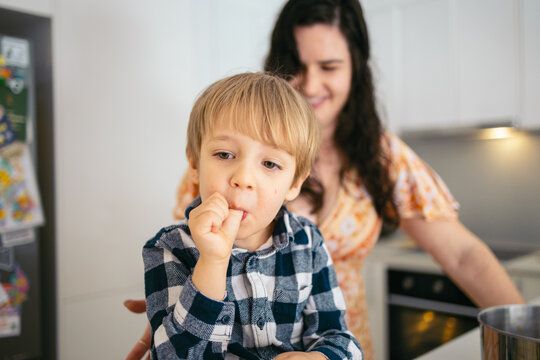 Child with their thumb in the mouth at home