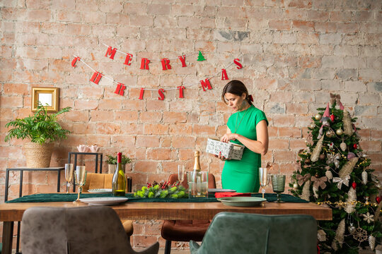 Woman setting Christmas table