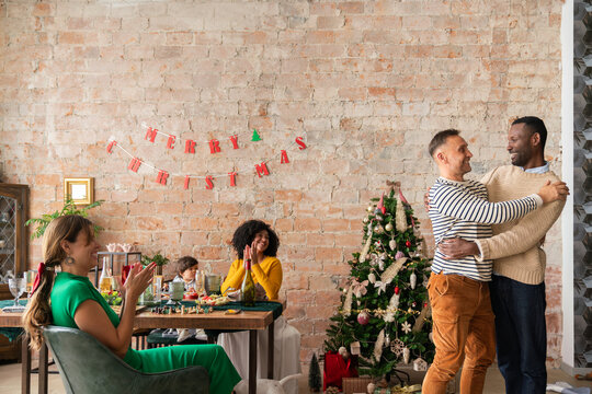 People hug after Christmas gift exchange time