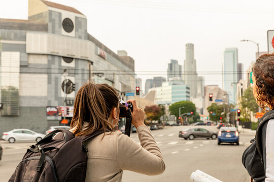 Capturing City Views: Tourist Photographs Downtown Skyscrapers"