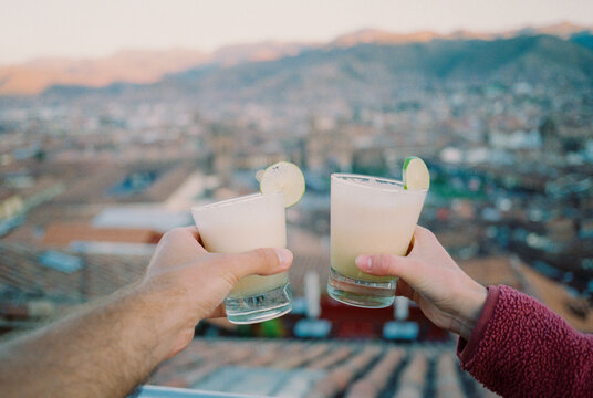 Drinking pisco sour on the rooftop overlooking Cusco town 