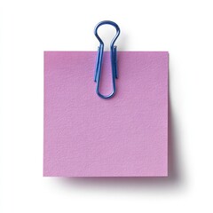 A square pink sticky note held by a blue binder clip, casting a shadow on a white background