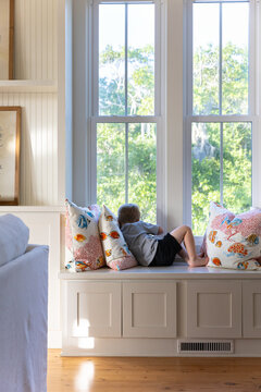 Boy Looking Out Window