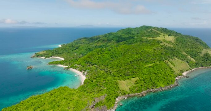 Cobrador Island with beach surrounded by coral reefs. Romblon, Philippines.