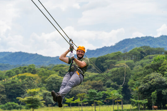 Man enjoying a zipline in a natural setting