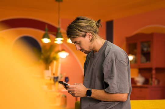 The guy immersed himself in his smartphone.