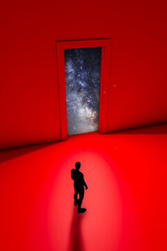 A man silhouette gazing at a cosmic doorway amidst a red backdrop