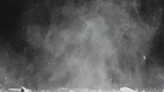 Explosion of shattered fragments and dust cloud in slow motion