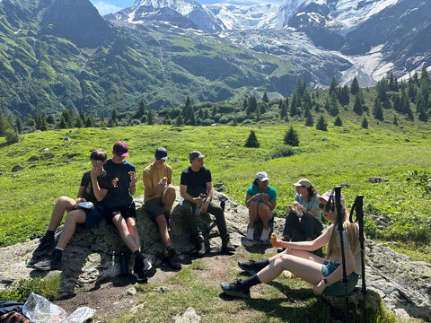 UGC of group resting on a trail,  Tour du Mont Blanc, Alps
